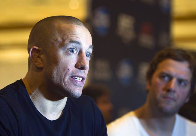 UFC welterweight champion Georges St. Pierre of Canada reacts to a question during a UFC news conference in the lobby of the MGM Grand Monday, July 29, 2013. St. Pierre will defend his welterweight title against Johny Hendricks of Dallas, Texas during UFC 167 on Nov. 17 at the MGM Grand.