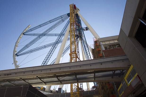 The 550-foot-tall High Roller observation wheel is shown under construction during a tour of Caesars Entertainment's Linq development Tuesday, July 29, 2013. The first phase of the $550 million shopping, dining and entertainment district is expected to open in late 2013. The High Roller is expected to open in 2014.