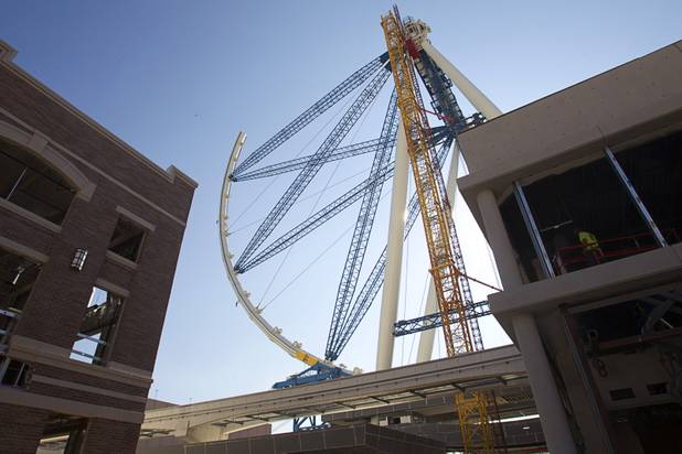The 550-foot-tall High Roller observation wheel is shown under construction during a tour of Caesars Entertainment's Linq development Tuesday, July 29, 2013. The first phase of the $550 million shopping, dining and entertainment district is expected to open in late 2013. The High Roller is expected to open in 2014.