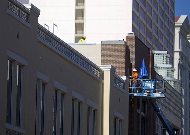 Workers are shown at Caesars Entertainment's Linq development Tuesday, July 29, 2013. The $550 million shopping, dining and entertainment district will be anchored by the 550-foot-tall High Roller observation wheel. The project's first phase is expected to open in late 2013.