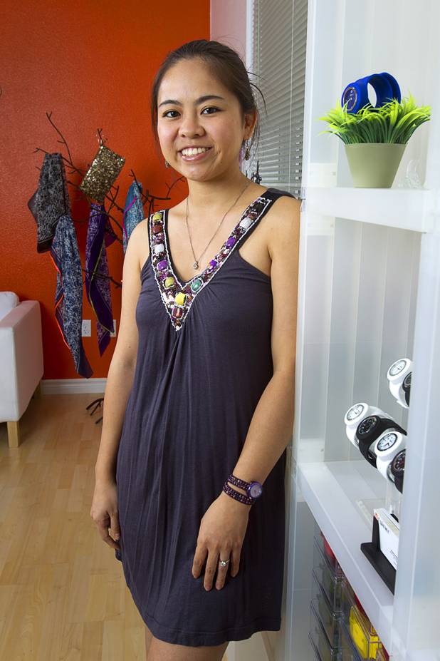Designer Winky Wu poses in her office Tuesday, July 30, 2013. Wu is founder of Winky Designs, a Vegas-based company that makes accessories like bright, fun watches, purses and belts.