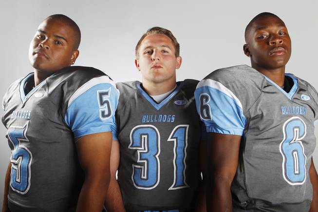 Centennial High School football players (from left) Toby Lopez, Josh Gray and Lantz Worthington before the 2013 season.