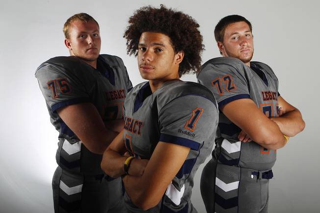 Legacy football players Matthew Sink, Devin Williams and Zach Lugris July 30, 2013.