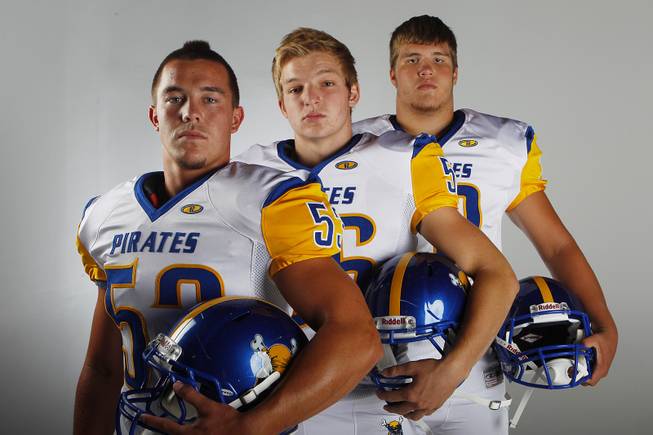 Moapa Valley High football players (from left) Sam Rebman, Jordan Grow and Mat McDermand before the 2013 season.