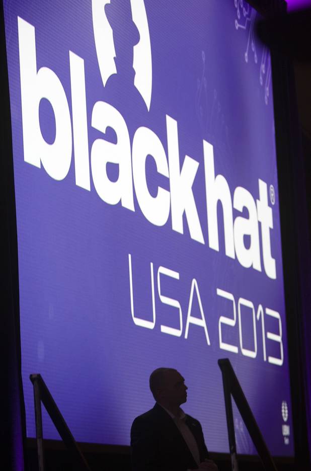 An official stands by the stage before a keynote address by General Keith Alexander, director of the National Security Agency (NSA), chief of the Central Security Service (CSS), and commander of the U.S. Cyber Command, during the Black Hat USA 2013 hacker convention at Caesars Palace Wednesday, July 31, 2013.