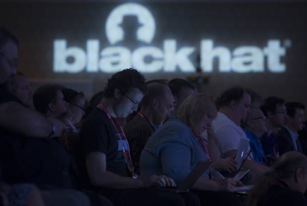 Black Hat USA 2013 attendees listen to a keynote address by General Keith Alexander, director of the National Security Agency (NSA), chief of the Central Security Service (CSS), and commander of the U.S. Cyber Command, during the hacker convention at Caesars Palace Wednesday, July 31, 2013.
