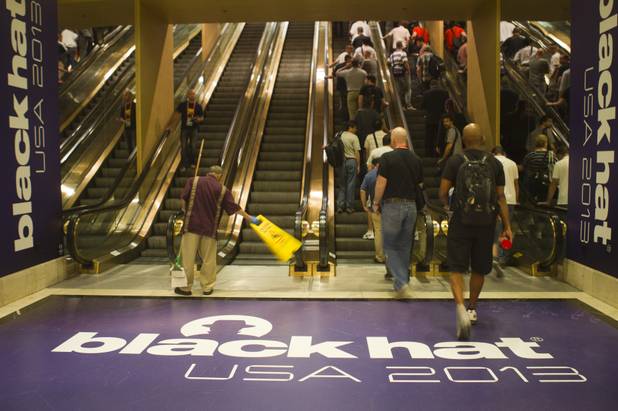 Black Hat USA 2013 attendees head to the convention center at Caesars Palace Wednesday, July 31, 2013.