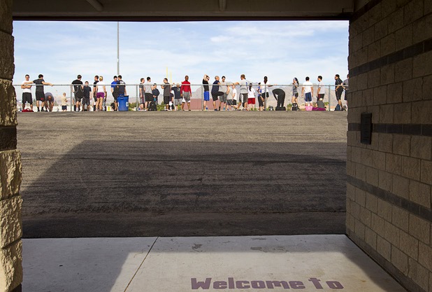 Metro Police recruit candidates get ready for the 100-yard dash during  physical fitness testing at Cimarron-Memorial High School Thursday, Aug. 1, 2013. The dash must be completed in 19 seconds or less.