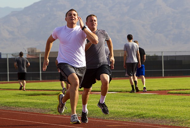 Metro Police recruit candidates Chris Pascoe, left, 21, and  Steven Kinsland, 25, run in the 100-yard dash during physical fitness testing at Cimarron-Memorial High School Thursday, Aug. 1, 2013. The dash must be completed in 19 seconds or less.