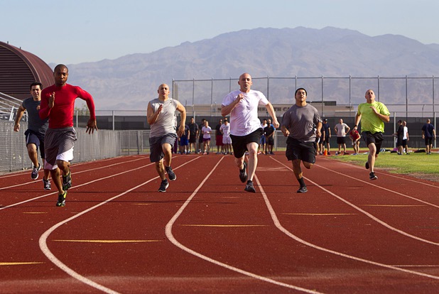 Metro Police recruit candidates run a 100-yard dash during physical fitness testing at Cimarron-Memorial High School Thursday, Aug. 1, 2013. The dash must be completed in 19 seconds or less.