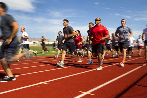 Metro Police recruit candidate start on a mile run during  physical fitness testing at Cimarron-Memorial High School Thursday, Aug. 1, 2013. The mile run must be completed in 10 minutes and 49 seconds or less.