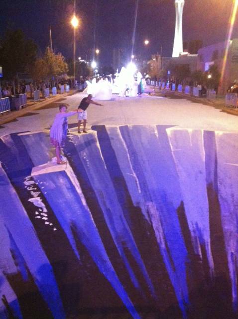 A blocklong section of Casino Center Boulevard has been transformed into an ice-themed 3-D street mural for First Friday on Aug. 2, 2013.
