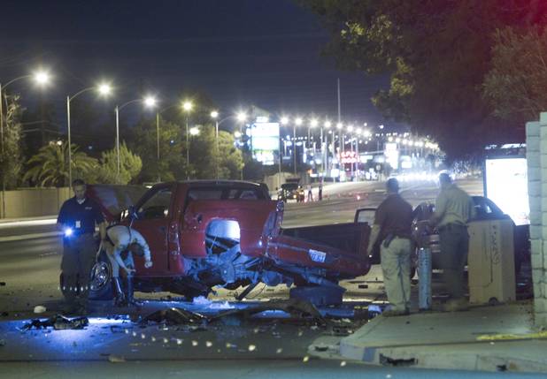 Metro Police investigate an accident involving five vehicles, including a limousine, at Rainbow Boulevard and Twain Avenue on Saturday, Aug. 3 2013. Several people were reported injured in the accident.