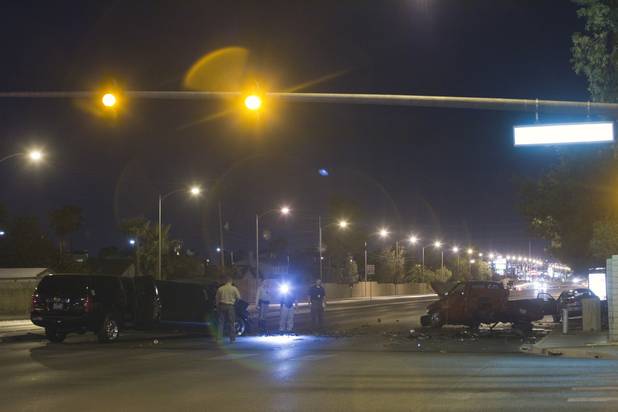 Metro Police investigate an accident involving five vehicles, including a limousine, at Rainbow Boulevard and Twain Avenue on Saturday, Aug. 3 2013. Several people were reported injured in the accident.