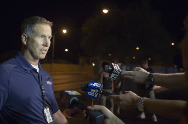 Metro Police Sgt. Richard Strader briefs reporters on an accident involving five vehicles, including a limousine, at Rainbow Boulevard and Twain Avenue on Saturday, Aug. 3, 2013. Several people were reported injured in the accident.