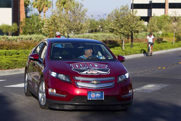 A Chevrolet Volt electric car from Findlay Chevrolet escorts members of the "Ride to the Future Tour" at Las Vegas Cyclery near I-215 and Town Center Drive Sunday, Aug. 4 2013. The tour of electric vehicles hopes to be certified for several Guinness World Records. The cross-country tour began July 4th in Charleston, South Carolina, and will end at Google Headquarters in Mountain View, Calif. on August 16.