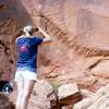 Chiara Velotta photographs petroglyphs on a rock outcropping at Gold Butte, Aug. 4, 2013.