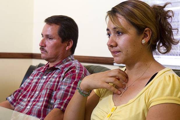 Inocente and Maria Hernandez listen to a question during an interview at the law offices of Langford McLetchie Monday, Aug. 5 2013. The family is suing Metro Police for failing to properly investigate when their daughter had her foot injured in an accident in 2011.
