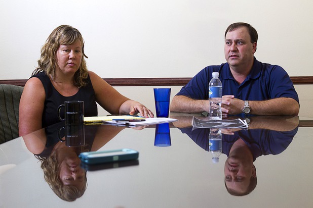 Attorneys Maggie McLetchie and George Tractman are shown during an interview at the law offices of Langford McLetchie Monday, Aug. 5 2013. The firm is representing a family who are suing Metro Police for failing to properly investigate when their daughter had her foot injured in an accident in 2011.