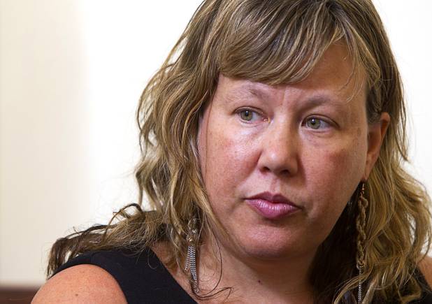 Attorney Maggie McLetchie listens to a question during an interview at the law offices of Langford McLetchie Monday, Aug. 5 2013. The firm is representing a family who are suing Metro Police for failing to properly investigate when their daughter had her foot injured in an accident in 2011.