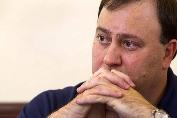 Attorney George Tractman listens during an interview at the law offices of Langford McLetchie Monday, Aug. 5 2013. The firm is representing a family who are suing Metro Police for failing to properly investigate when their daughter had her foot injured in an accident in 2011.
