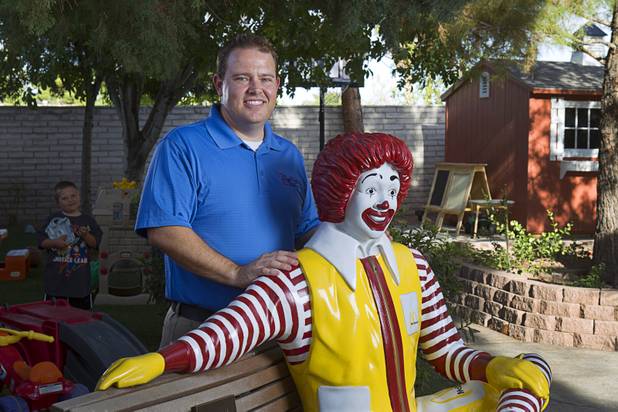 Jeremy Anderson, general manager of Aire Serv, poses by a statue of Ronald McDonald at the Ronald McDonald House Monday, Aug. 5 2013. The The Ronald McDonald House provides temporary housing for families who travel to Las Vegas to receive critical medical treatment for their children.