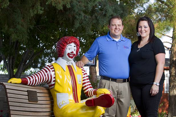 Jeremy Anderson, general manager of Aire Serv, poses with his fiancee Mical Henderson by a statue of Ronald McDonald at the Ronald McDonald House Monday, Aug. 5 2013. The The Ronald McDonald House provides temporary housing for families who travel to Las Vegas to receive critical medical treatment for their children.