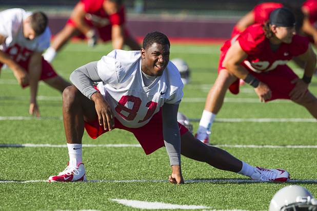 UNLV wide receiver Devante Davis stretches out during practice at UNLV Tuesday, Aug. 6, 2013.