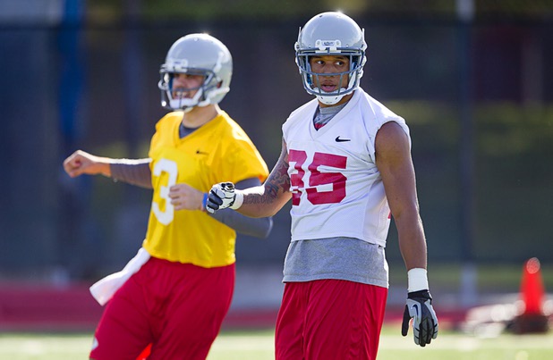 Running back Tim Cornett, right, is shown during practice at UNLV Tuesday, Aug. 6, 2013. Quarterback Nick Sherry is at left.