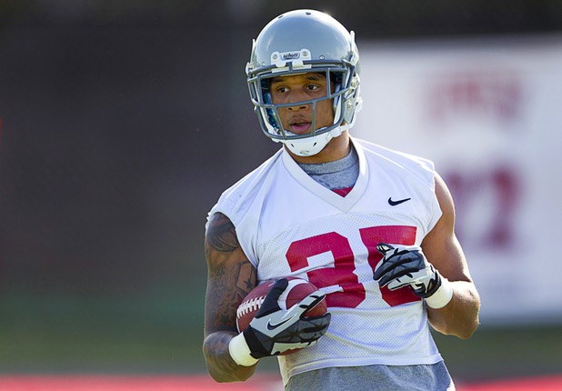 Running back Tim Cornett carries the ball during practice at UNLV Tuesday, Aug. 6, 2013.