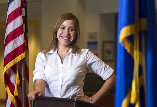 Jessica Padron poses at a podium in the lobby of the Sawyer State Building on Wednesday, Aug. 7, 2013. Padron was chosen for an internship at Senate Majority Leader Harry Reid's office in Washington, D.C., but needs to raise money to go because the internship is unpaid. 