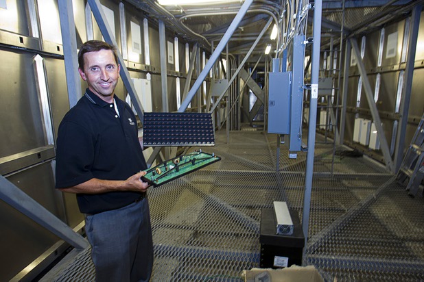 Jeff Young, YESCO senior vice president and chief marketing officer, holds LED panels inside the new Aria sign on Las Vegas Boulevard South Wednesday, Aug. 7, 2013. The new sign, the tallest on The Strip, is 250 feet tall, 65 feet wide and packed with 11 million pixels spread over 10,000 square feet of LED screen.