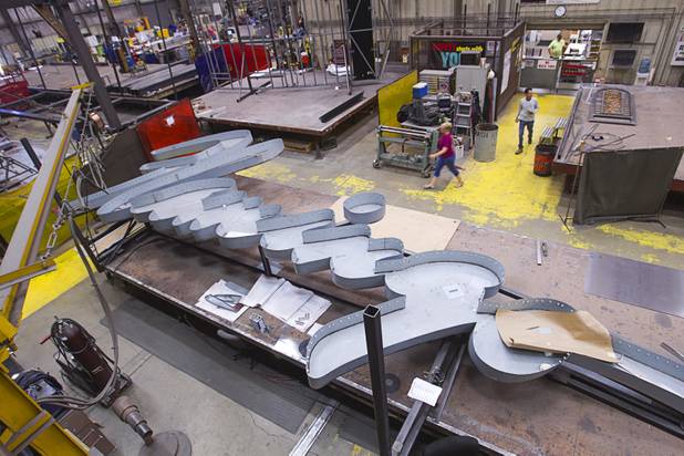 A view of outdoor signs under construction on the shop floor at the YESCO facility in Las Vegas Wednesday, Aug. 7, 2013.