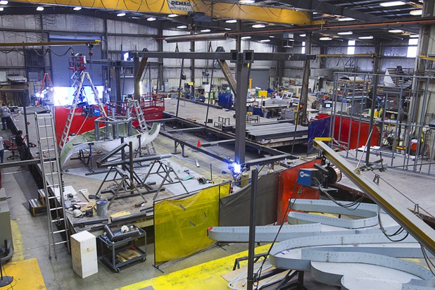 A view of outdoor signs under construction on the shop floor at the YESCO facility in Las Vegas Wednesday, Aug. 7, 2013.