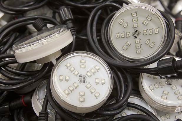LED "pucks" are displayed at the YESCO facility in Las Vegas Wednesday, Aug. 7, 2013.