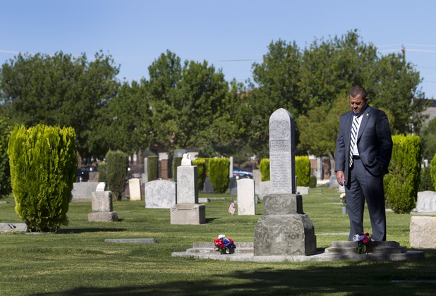 James Mullikin, managing partner of Bunkers Mortuaries, Cemeteries & Crematory, stands by the gravesite of Civil War veterans Joseph Moore Graham and William Boone Keith at Woodlawn Cemetery Thursday, Aug. 8, 2013. Opened in 1914 on 10 acres of donated land, Woodlawn, the oldest cemetery in Las Vegas, is coming up on its 100th anniversary.