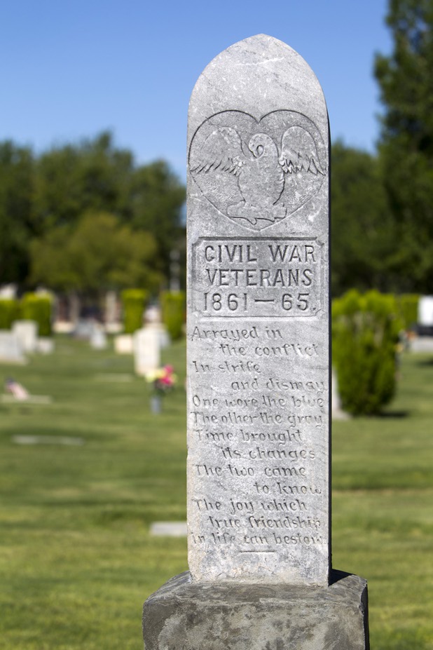 A poem for Civil War veterans Joseph Moore Graham and William Boone Keith is shown at Woodlawn Cemetery Thursday, Aug. 8, 2013. Opened in 1914 on 10 acres of donated land, Woodlawn, the oldest cemetery in Las Vegas, is coming up on its 100th anniversary.