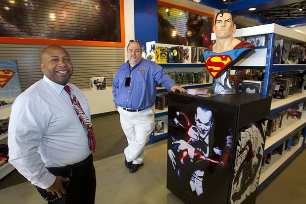Owners Derrick Taylor, left, and Chandler Rice pose in Supernova Comics after a ribbon-cutting ceremony at the Neonopolis Mall in downtown Las Vegas Thursday, Aug. 8, 2013.