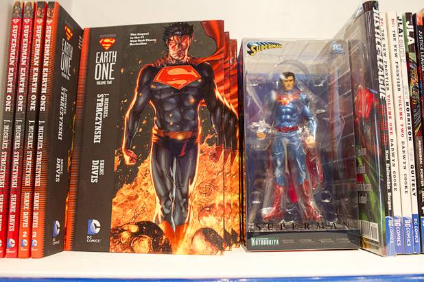 Graphic novels and a Superman figurine are displayed at Supernova Comics in the Neonopolis Mall in downtown Las Vegas Thursday, Aug. 8, 2013.