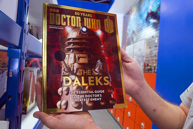 Michael Chalmers,  manager of Supernova Comics, displays a book from the Doctor Who section in the Neonopolis Mall in downtown Las Vegas Thursday, Aug. 8, 2013.