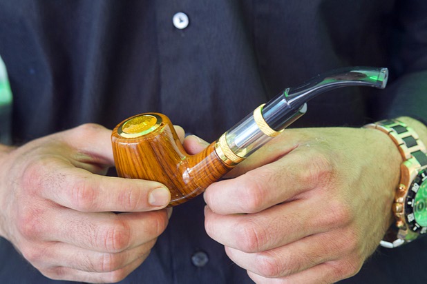Tariq Ibraham, owner of Evapor8, holds an e-pipe at the the a hookah lounge and vapor boutique in the Neonopolis Mall in downtown Las Vegas Thursday, Aug. 8, 2013.