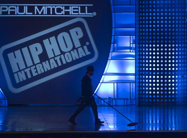 A man dust mops the dance floor before the World Hip Hop Championships at the Orleans Arena Sunday, Aug. 11, 2013. Teams from 43 countries competed in the event.