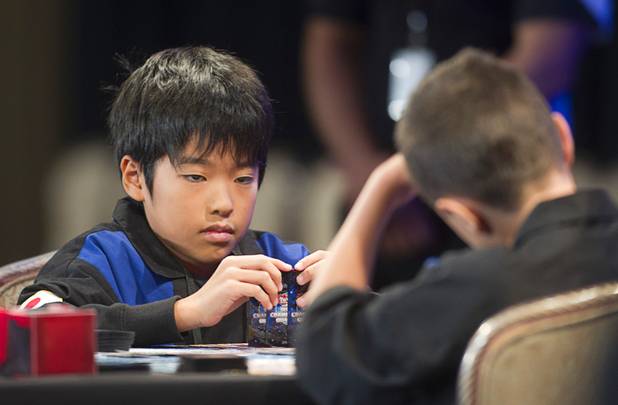 Mao Goto of Japan plays against Oliver S. Tomajko of the U.S. during the Yu-Gi-Oh! Trading Card Game world championships at Bally's Sunday, Aug. 11, 2013. Twelve players competed in the Dragon Duel for players 12-years-old and younger. Tomajko beat Goto for first prize in the division.