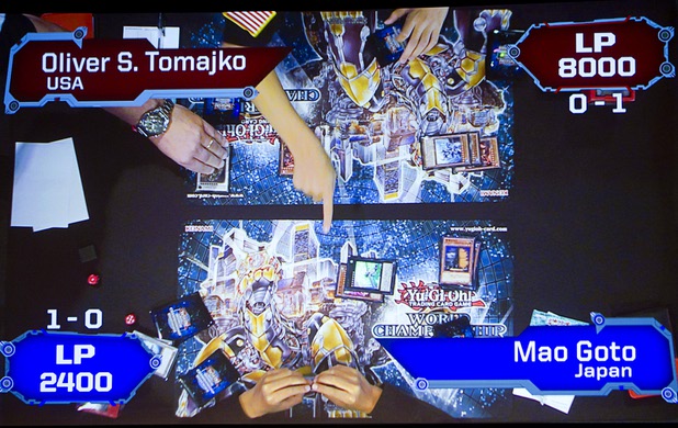 An overhead camera shows a live feed of game play as Mao Goto and Oliver S. Tomajko compete during the Yu-Gi-Oh! Trading Card Game world championships at Bally's Sunday, Aug. 11, 2013. Twenty-six players of the best players from around the world competed in the tournament. Twelve players competed in the Dragon Duel for players 12-years-old and younger. The battle-based card game by Konami was named the top selling trading card game in the world by Guinness World Records in 2009.