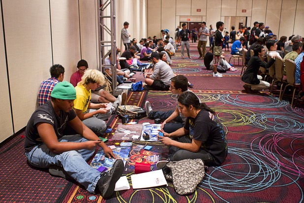 Audience members play their own games during the final match of the Yu-Gi-Oh! Trading Card Game world championships at Bally's Sunday, Aug. 11, 2013. Twenty-six players of the best players from around the world competed in the tournament. Twelve players competed in the Dragon Duel for players 12-years-old and younger. The battle-based card game by Konami was named the top selling trading card game in the world by Guinness World Records in 2009.