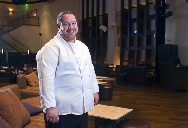 Chef Doug Bell poses in the Heraea restaurant in the Palms Monday, Aug. 12, 2013.