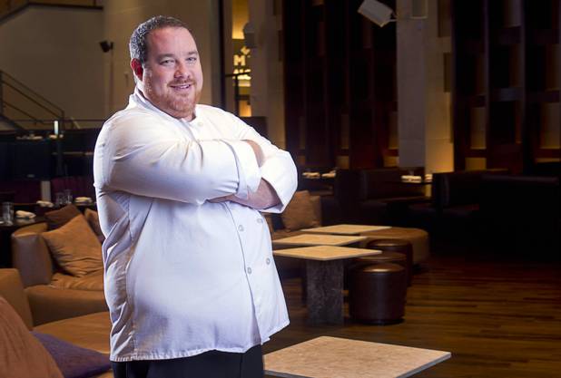Chef Doug Bell poses in the Heraea restaurant in the Palms Monday, Aug. 12, 2013.