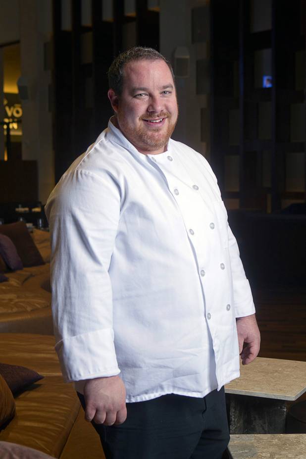 Chef Doug Bell poses in the Heraea restaurant in the Palms Monday, Aug. 12, 2013.