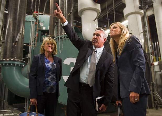Chris Magee, center, executive director of sustainable facilities for MGM Resorts, points out energy efficient features to Phyllis Cuttino, right, director of Pews Clean Energy Program, during a tour of CityCenters cogeneration plant Monday, Aug. 12, 2013. Cindy Ortega, senior vice president and chief sustainability officer of MGM Resorts, looks on at left. Cuttino is town to attend the National Clean Energy Summit 6.0 which begins Tuesday, Aug. 13 at Mandalay Bay.