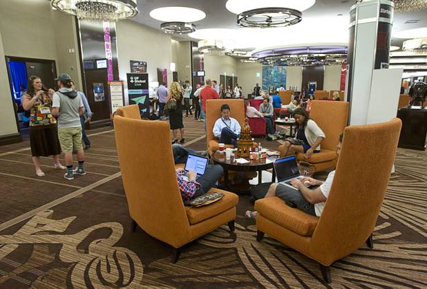 People work in a common area during the South By Southwest V2V tech conference for entrepreneurs at the Cosmopolitan Monday, Aug. 12, 2013.